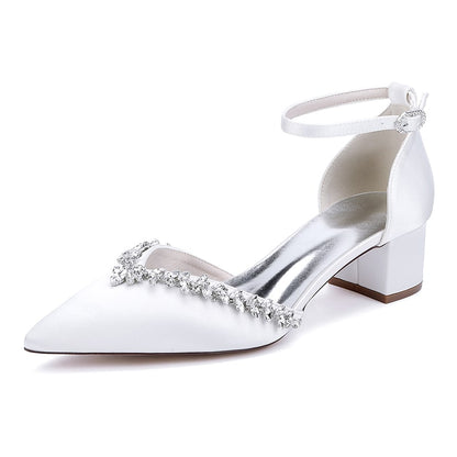 Elegant white wedding ankle strap heels for bride with a decorative crystal embellishment