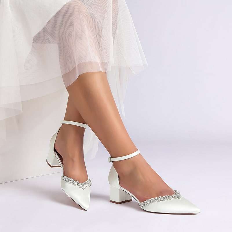 Elegant wedding ankle strap heels for bride in white with decorative embellishments