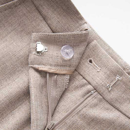 Close-up of a formal women's vest pantsuit wedding featuring elegant fabric and detailed stitching