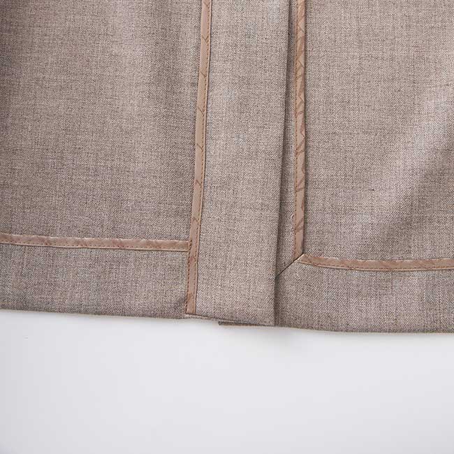 Close-up of the stitching detail on a formal women's vest pantsuit wedding by SD Dresscode & Fashiontrends