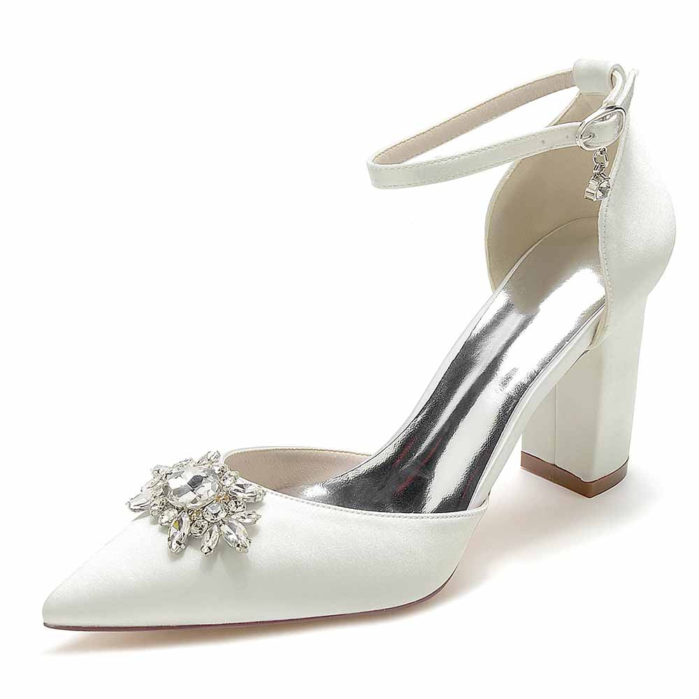 Elegant white point toe satin wedding shoes with a jeweled embellishment and ankle strap for brides