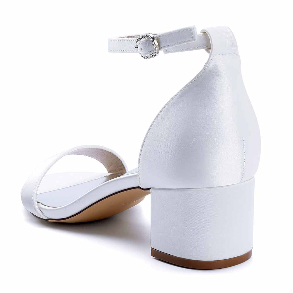 White chunky heel wedding sandals with ankle strap and smooth finish for brides and special occasions