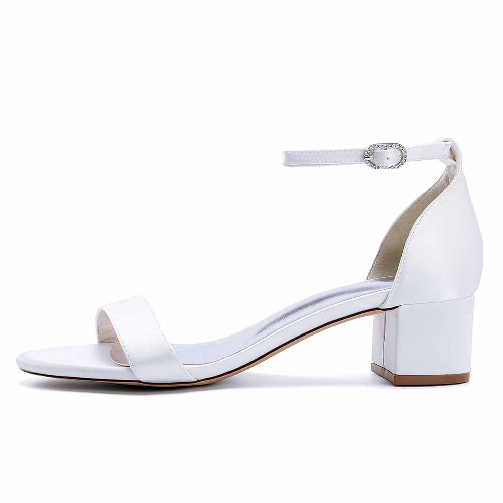 White chunky heel wedding sandals with ankle strap and elegant design for special occasions