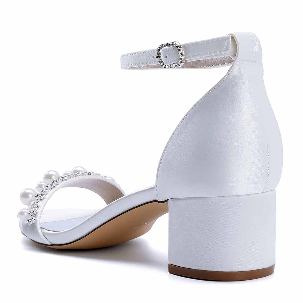 Elegant block heel wedding sandals for women with pearl embellishments and ankle strap.
