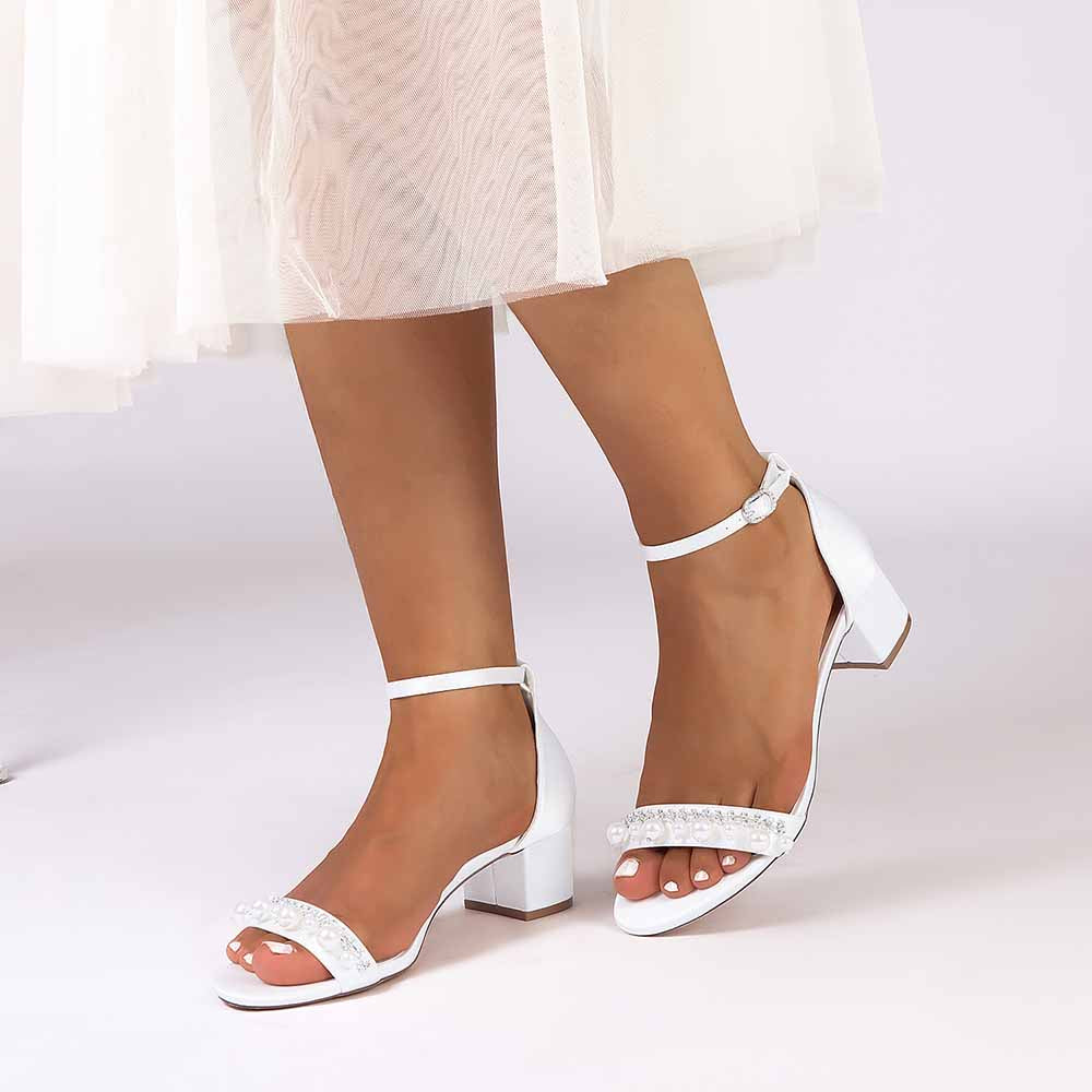 Stylish block heel wedding sandals for women in white with ankle strap and embellished details