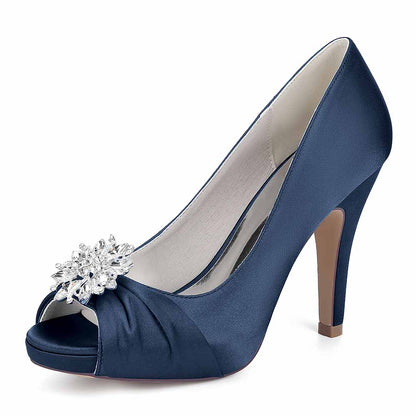 Elegant S&DCo. satin peep toe wedding shoes in navy blue with a sparkling jeweled embellishment