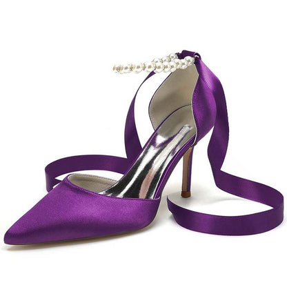 Elegant purple heels with satin finish and pearl detail, perfect shoes for the wedding