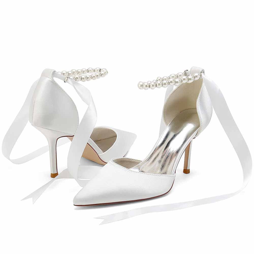 Elegant white heels with pearl ankle straps and satin ribbons, perfect shoes for the wedding