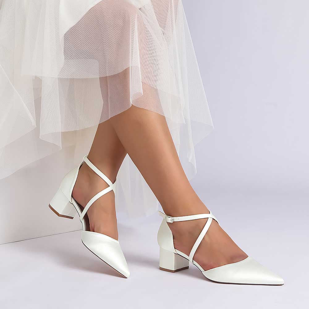 Elegant white wedding shoes with ankle strap and block heel, perfect for bridal occasions