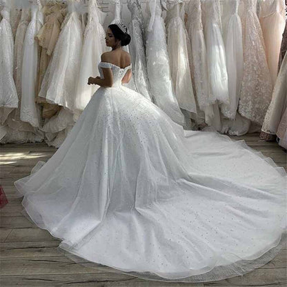 Off-the-Shoulder Sweep Train Tulle Wedding Dresses