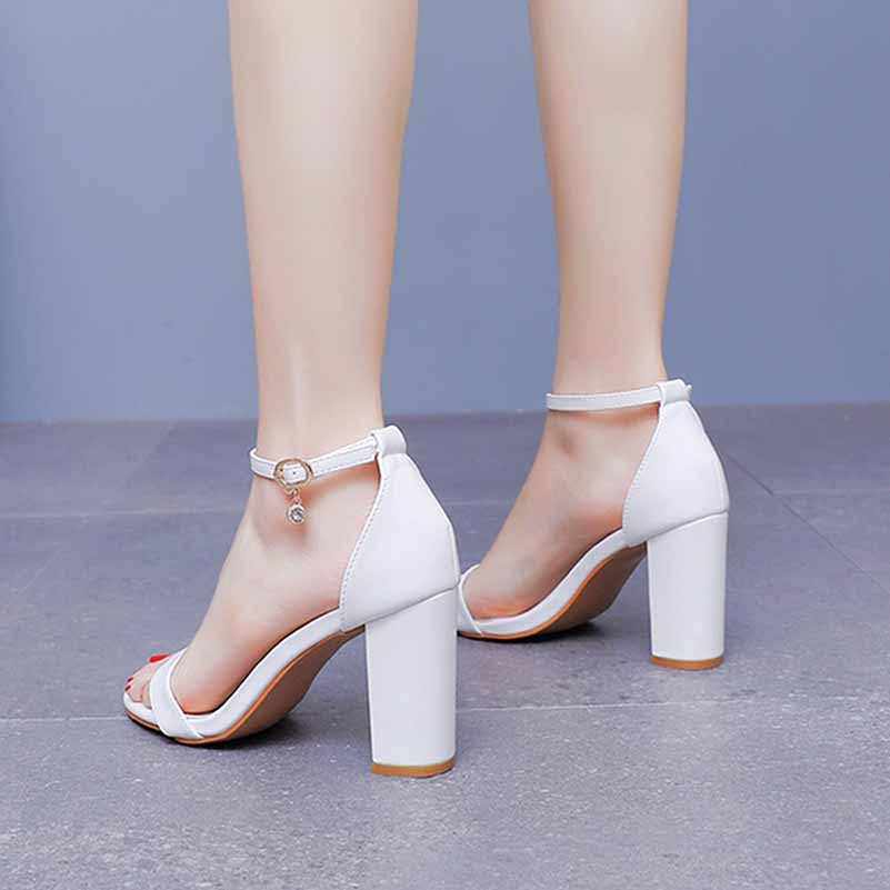 Stylish white ankle strap chunky heels from S&DCo. with a modern design and comfortable fit
