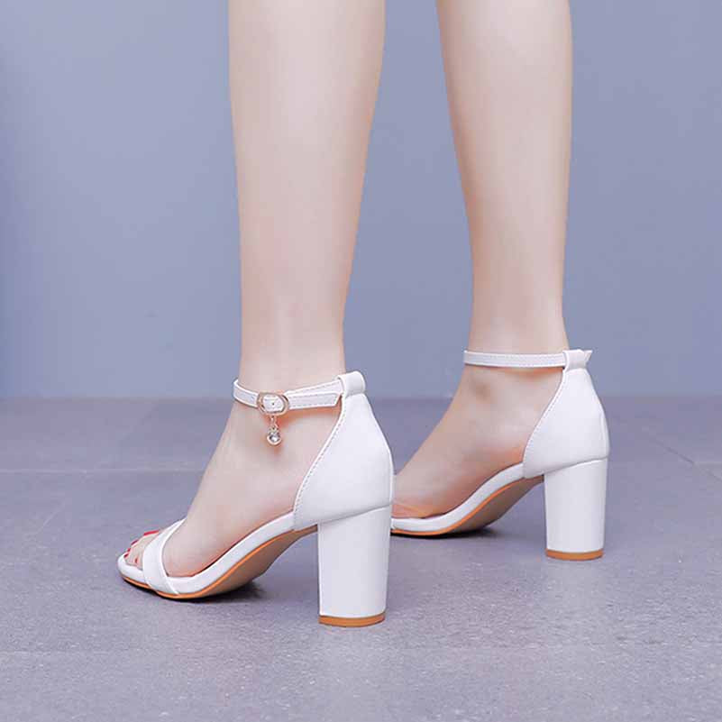 White ankle strap chunky heels from S&DCo. featuring a stylish design and durable chunky heel