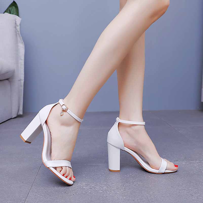 Elegant white ankle strap chunky heels with a stylish design for versatile outfits