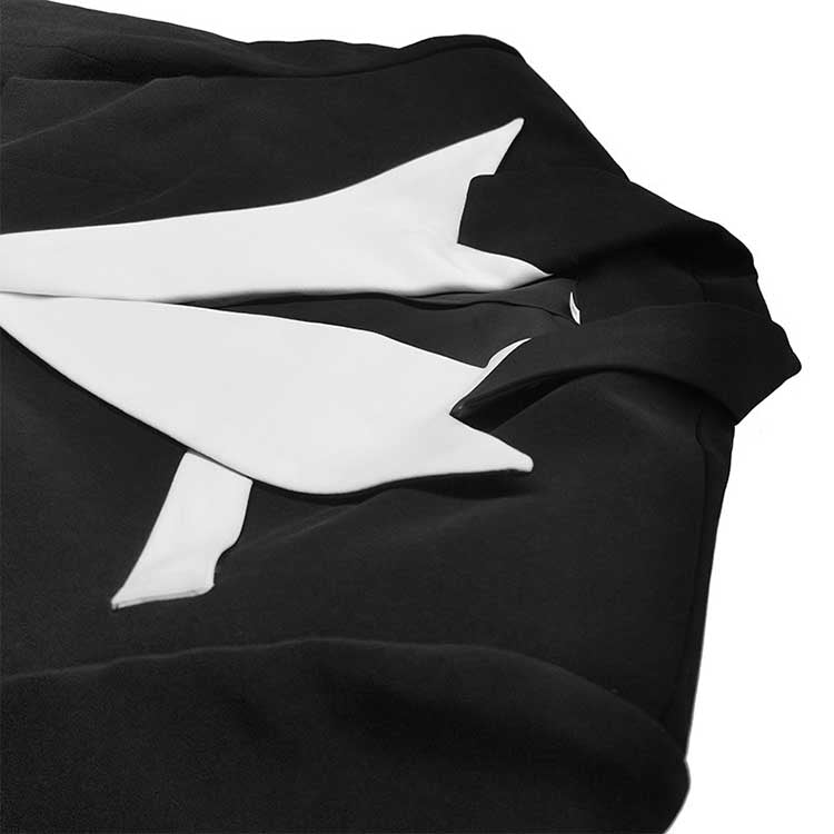 Elegant white collar two piece pantsuit featuring a stylish black and white design for formal occasions