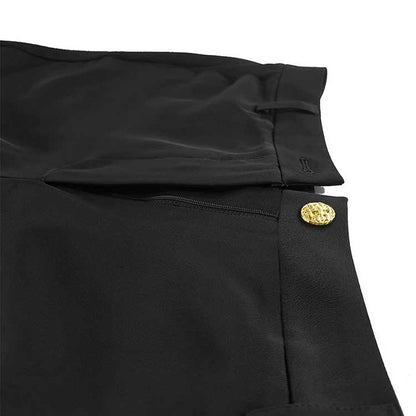 Close-up of a black pant suit showcasing the detailed waistband and gold button of the white collar two piece pantsuit