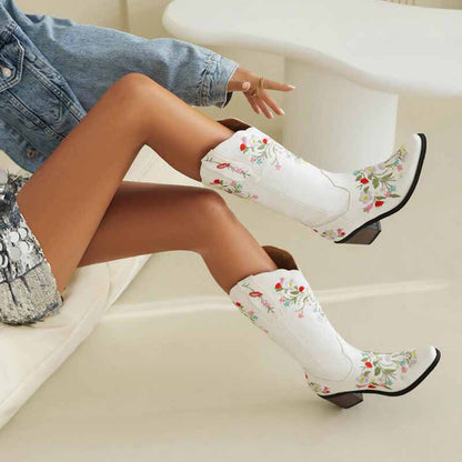 White embroidered cowboy boots for women featuring floral designs and a stylish pointed toe
