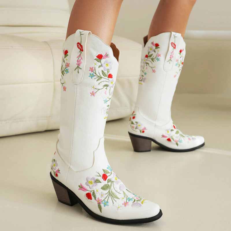 Stylish white embroidered cowboy boots for women featuring floral designs and a comfortable heel