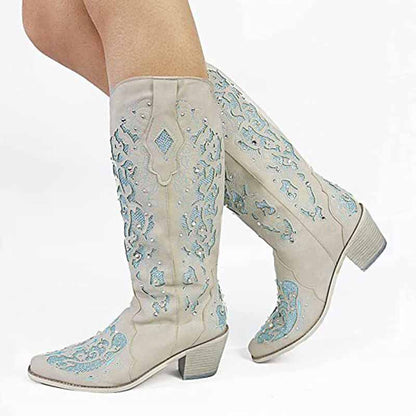 Stylish white glitter wedding boots with intricate blue embroidery, perfect for bridal attire