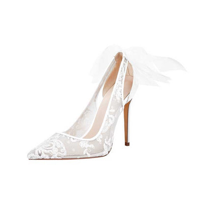 Elegant white lace bridal stilettos with delicate feather embellishments for a luxurious wedding look