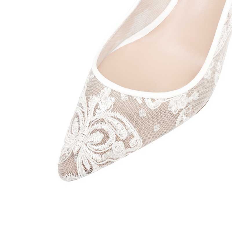 Elegant white lace bridal stilettos with intricate floral patterns for a perfect wedding look