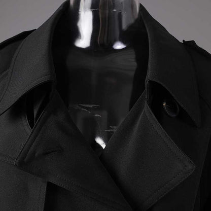 Close-up of a black British style trench coat for women showcasing the collar and fabric details