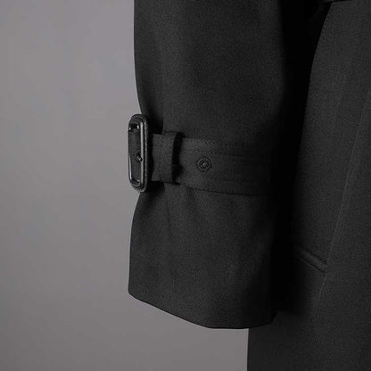 Close-up of the cuff detail on a British style trench coat for women, featuring a classic design and buckle
