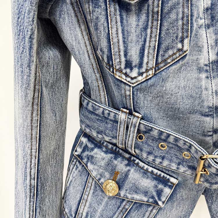Close-up of a women's belted denim jacket featuring stylish pockets and a classic design