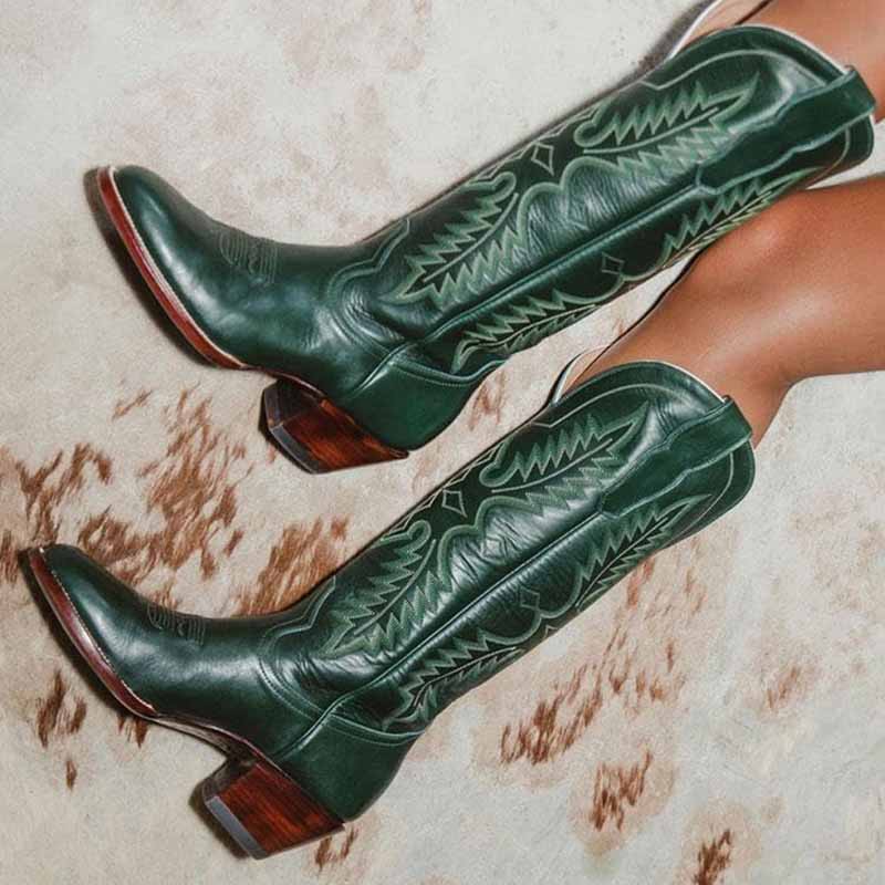 Women vintage cowboy boots in green leather with intricate detailing and a stylish heel