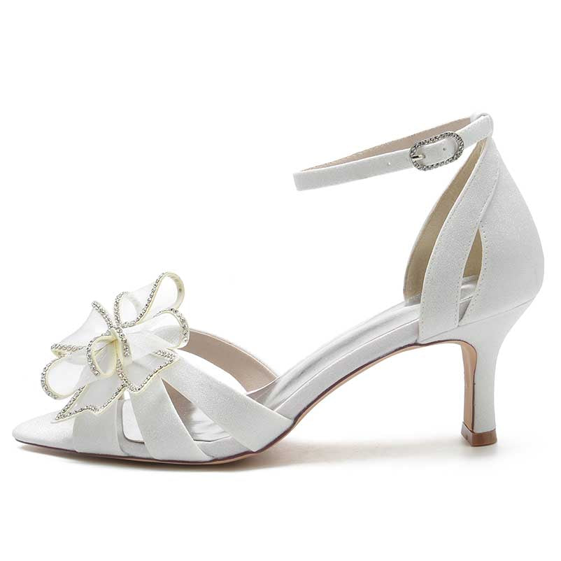 Elegant women's ankle strap dress sandals in white with decorative flower detail and mid-heel