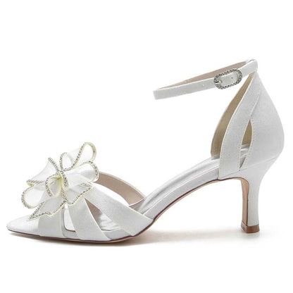 Elegant women's ankle strap dress sandals in white with decorative flower detail and mid-heel