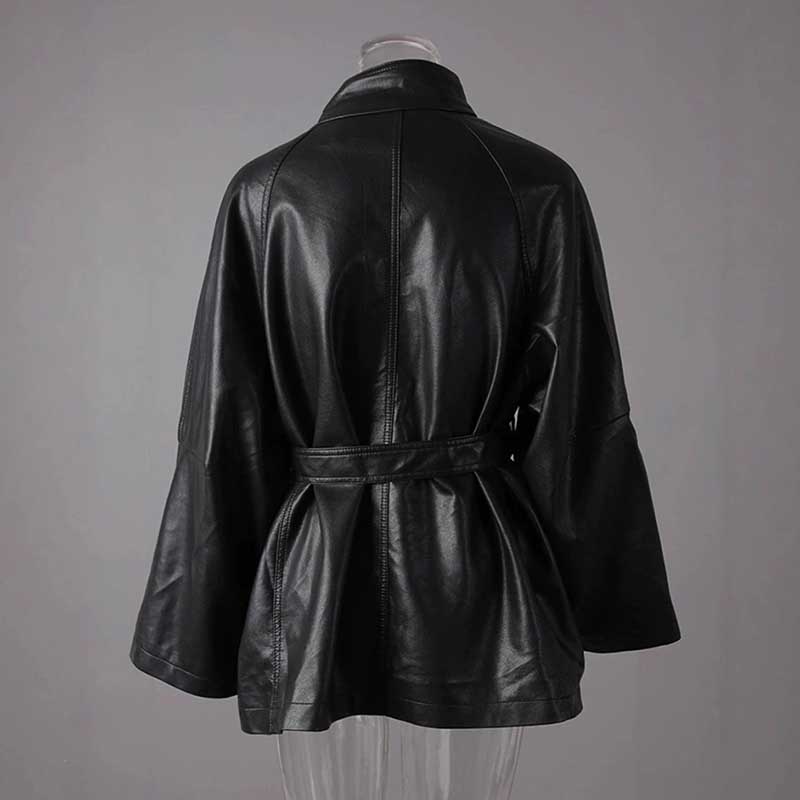 Back view of women's belted leather jacket with pockets, featuring a stylish design and comfortable fit