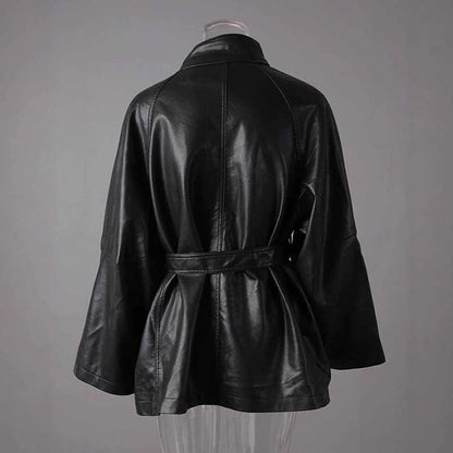 Back view of women's belted leather jacket with pockets, featuring a stylish design and comfortable fit