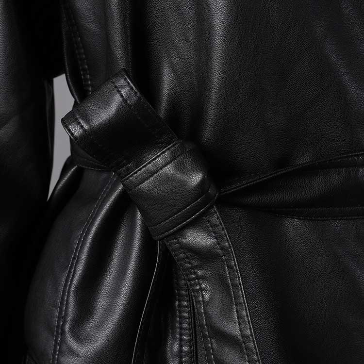 Close-up of women's belted leather jacket with pockets showcasing the stylish belt and texture