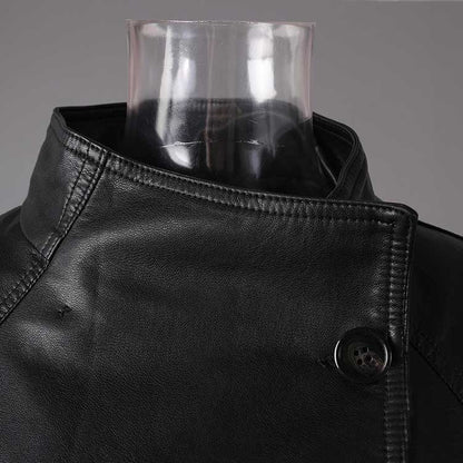 Close-up of a women's belted leather jacket with pockets showcasing detailed stitching and collar design