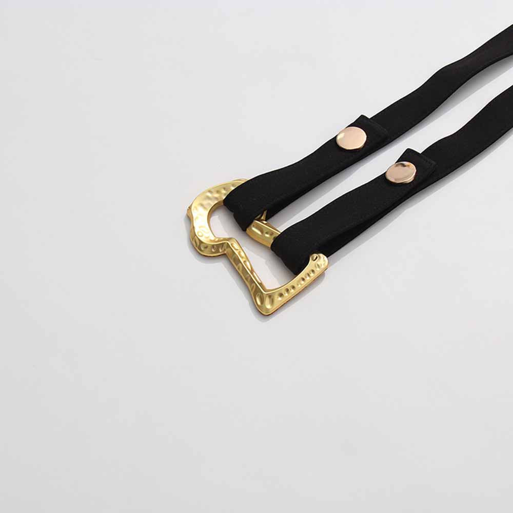 Belt detail of a women's black belted winter coat showcasing elegant gold buckle design