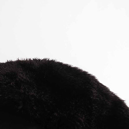 Close-up of women's black belted winter coat featuring a soft fur collar for added warmth and style