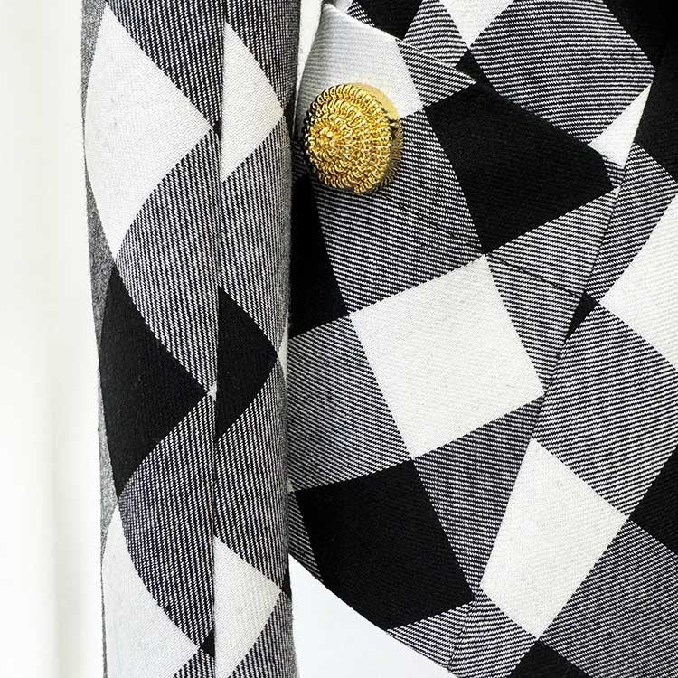 Close-up of women's black checked blazer coat featuring a stylish patterned design and button detail