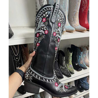 Women's black embroidered cowboy boots with floral designs and a stylish heel