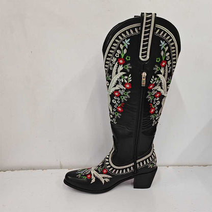 Stylish women's black embroidered cowboy boots with intricate floral designs and a low heel