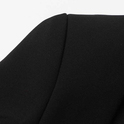 Close-up of a women's black maxi blazer coat highlighting the sleek fabric and tailored design