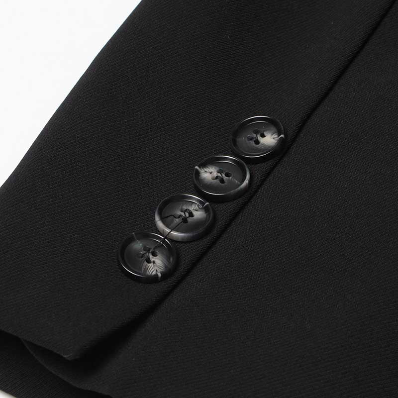 Detail of women's black maxi blazer coat showing black buttons and sleek design for elegant outfits