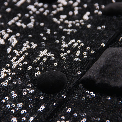 Close-up of women's black sequin blazer showcasing shimmering sequins and velvet details