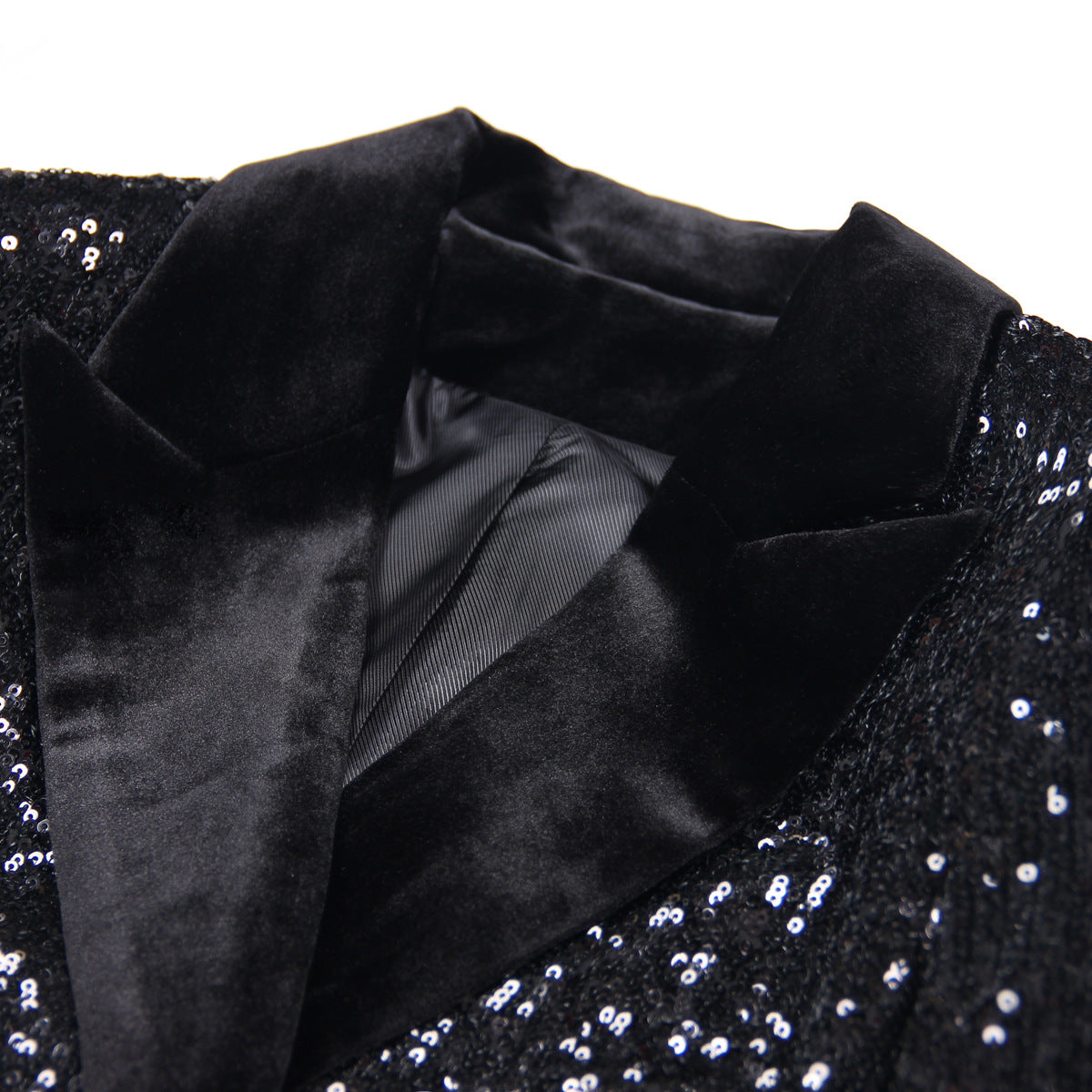 Close-up of a women's black sequin blazer showcasing luxurious fabric and elegant design details