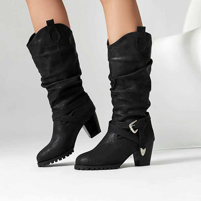Stylish women's block heel knee high boots in black with slouchy design and buckle embellishment