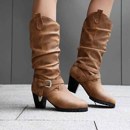Stylish women's block heel knee high boots in tan with slouchy design and decorative strap detail
