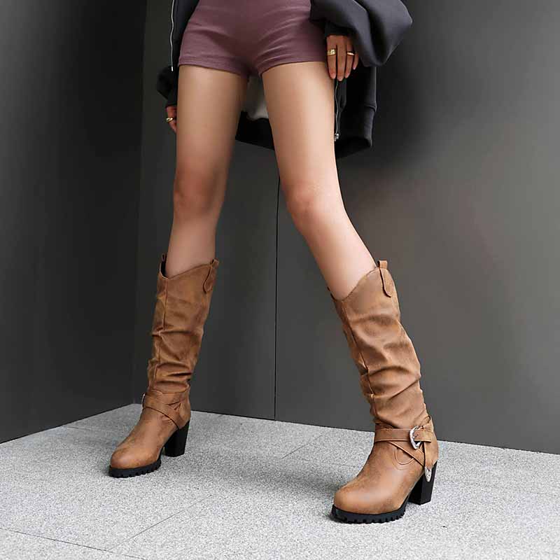 Stylish women's block heel knee high boots in tan with a slouchy design and side buckle detail