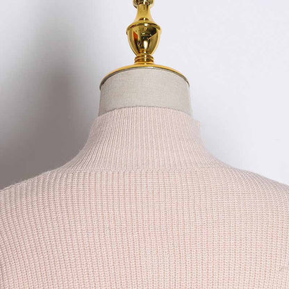 Back view of women's bow detail sweater in soft pink color with a high neck design