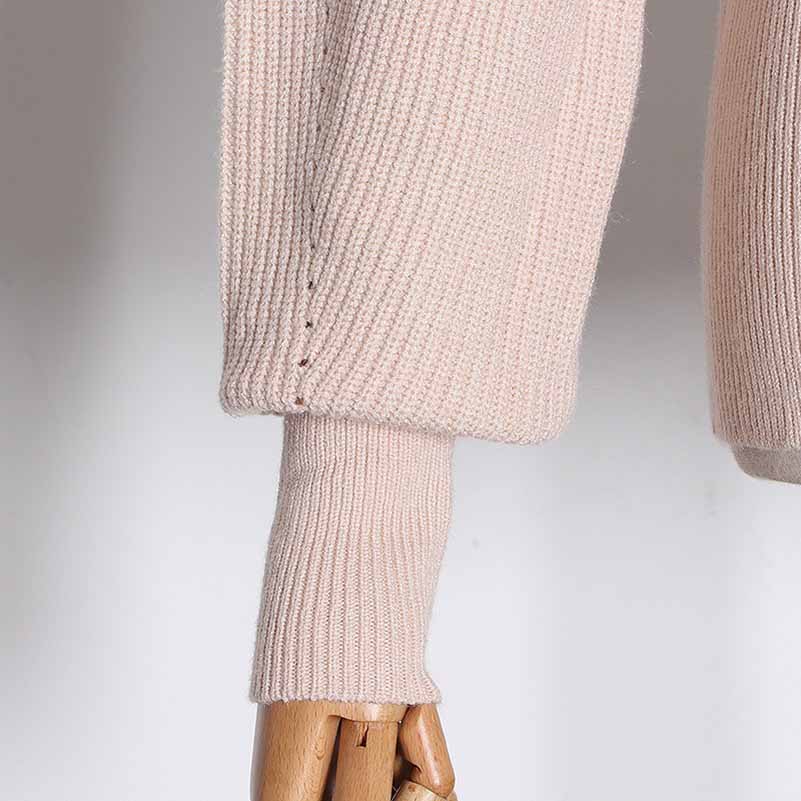 Soft pink women's bow detail sweater featuring ribbed cuffs and stylish design for casual wear