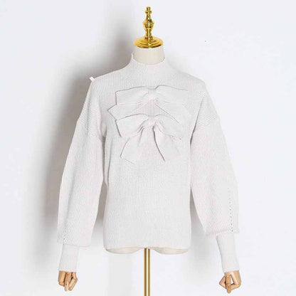 Stylish women's bow detail sweater in light gray with dramatic bow accents for a trendy look