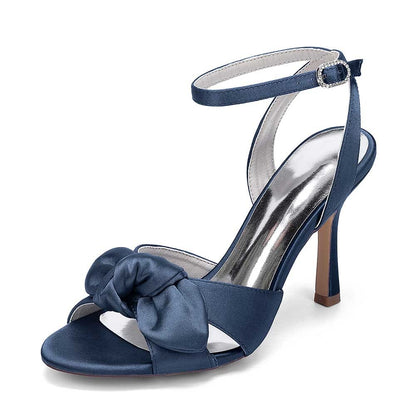 Elegant women's bridal silk satin heels in navy blue with a stylish bow and ankle strap